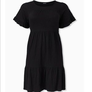 Black shirted hem mini dress